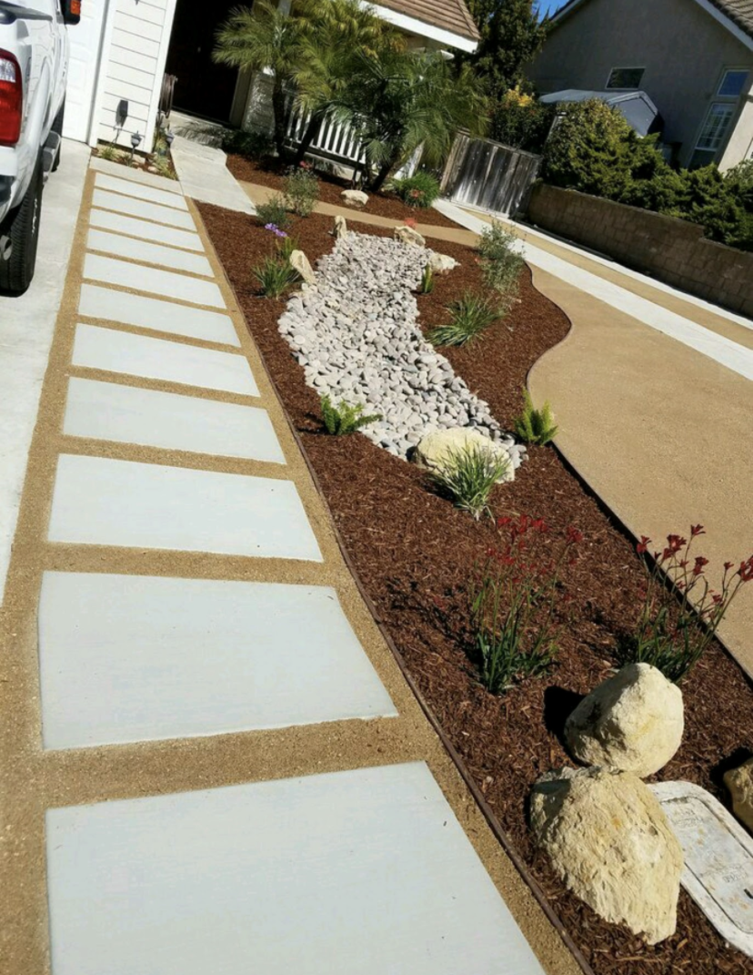 Concrete walkway with drought-tolerant landscaping